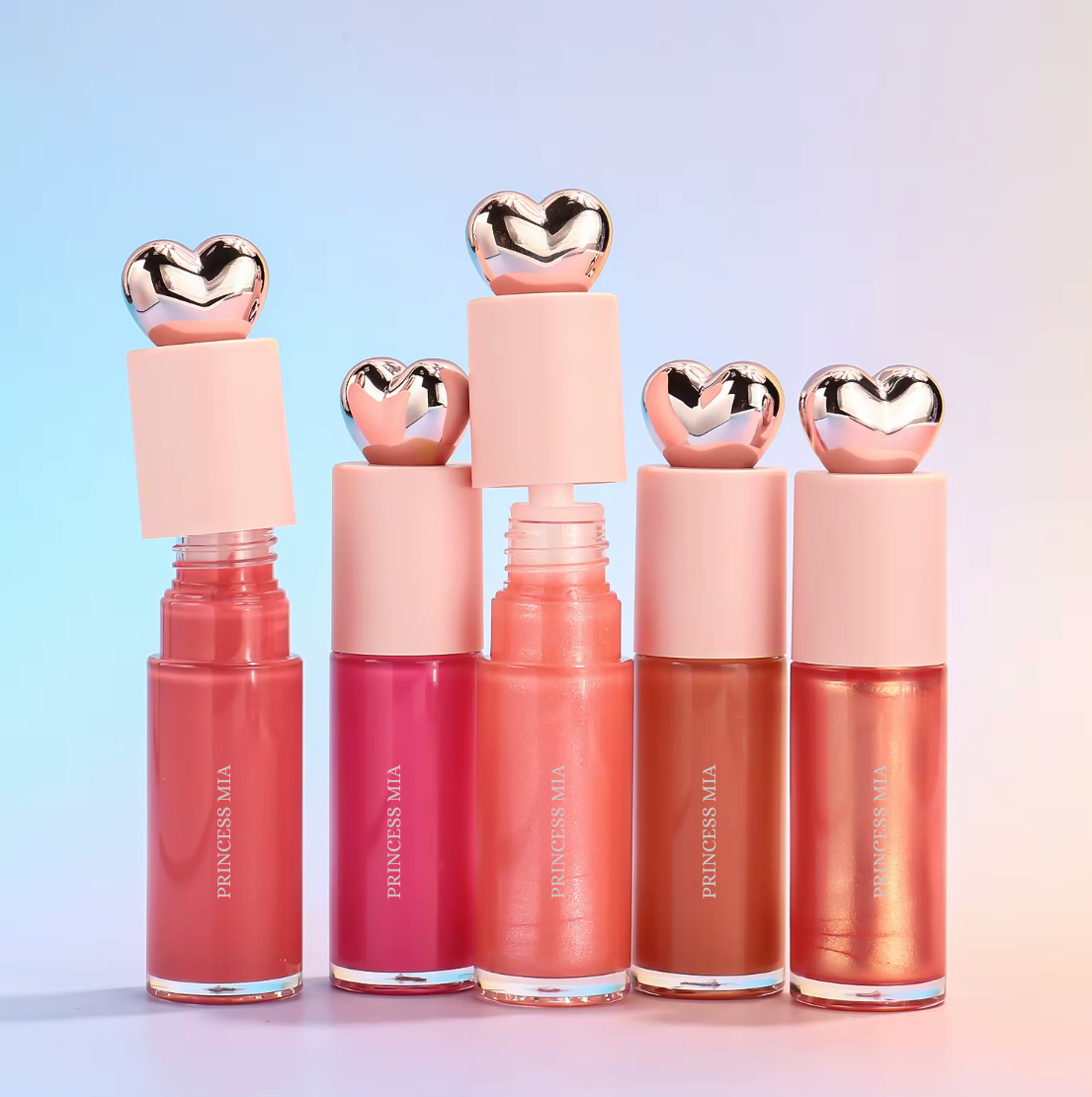 Set of five lip glosses with heart-shaped caps on a gradient background