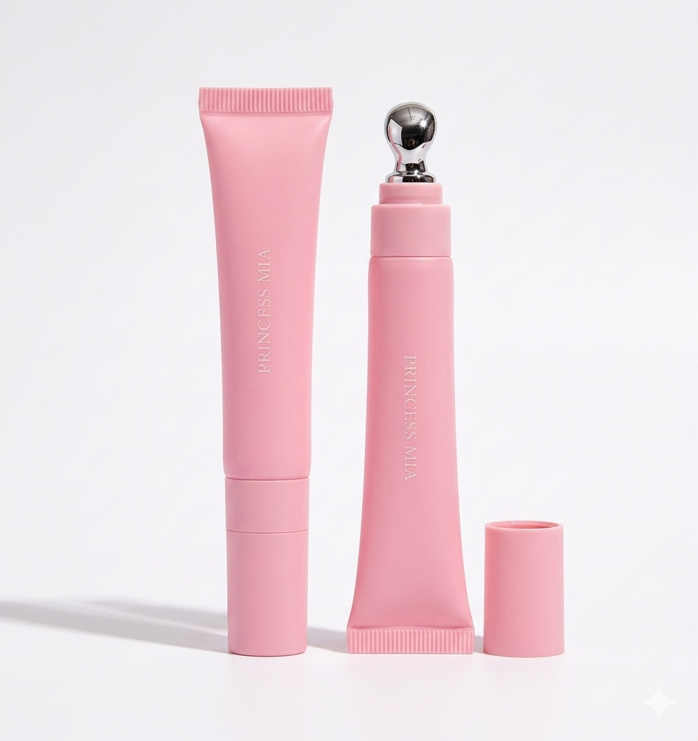 Pink skincare product set with applicator on a light gray background