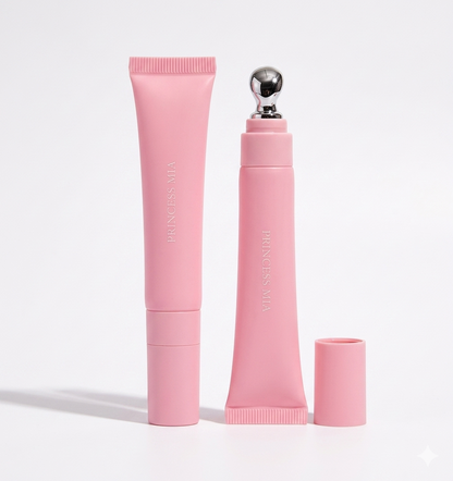 Pink skincare product set with applicator on a light gray background