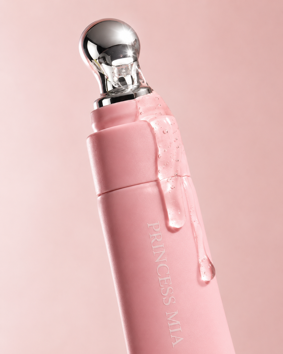 Pink skincare device with silver top on a pink background, branded 'Princess Mia'.