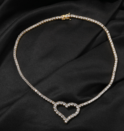 Necklace with a heart-shaped clasp on a black fabric background